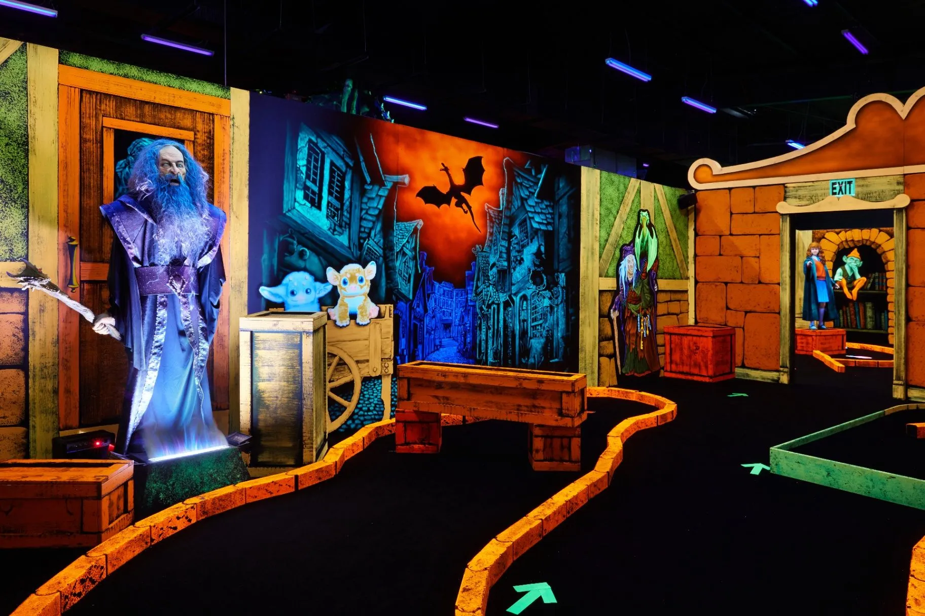 Wizard figure and fantasy castle scenes on the course